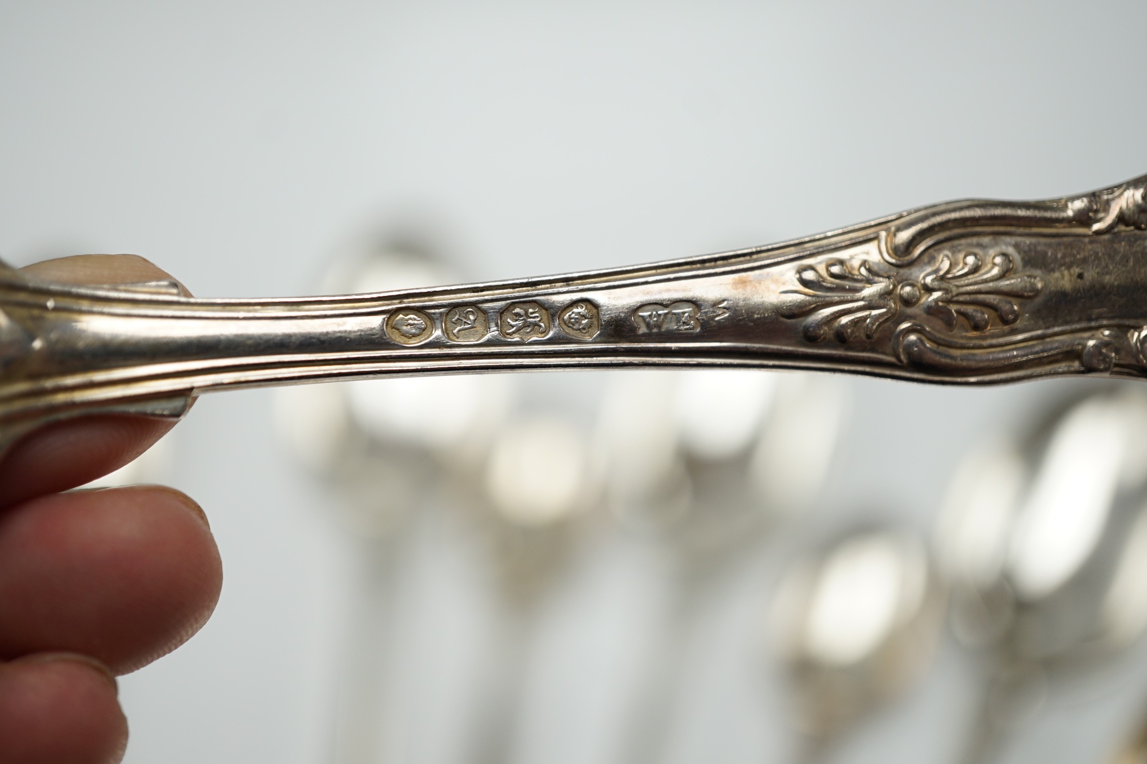 A set of six Victorian silver fiddle pattern table spoons, Samuel Hayne, London, 1863 and a set of late William IV silver King's pattern teaspoons, William Eaton, London, 1836, 21oz.